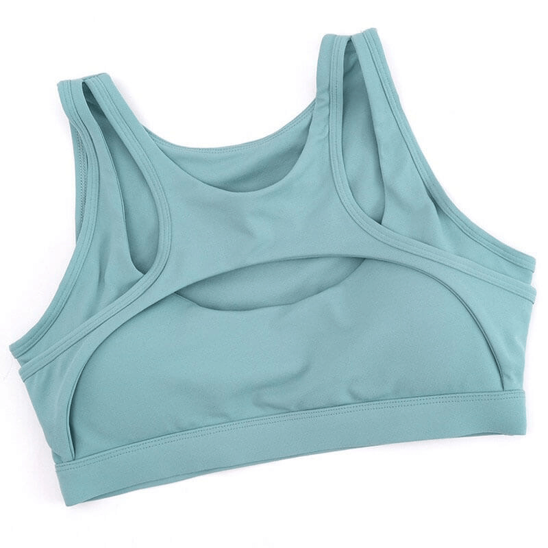 Mint green athletic women's sports bra for yoga and fitness, made with breathable, quick-dry fabric for comfort and support.